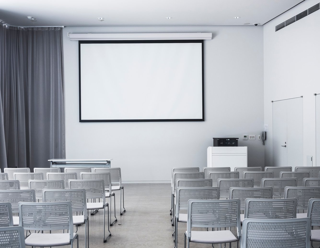 Blank Mock up Screen display with Seats in Seminar room Education training class